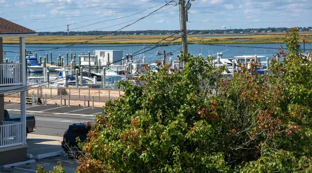 a view of a swimming pool and an outdoor seating