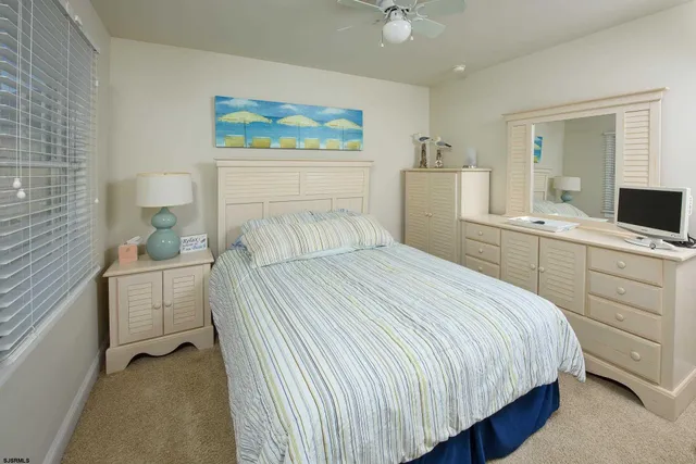 a bedroom with a bed and a table