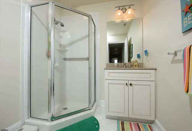 a bathroom with a mirror a sink and a mirror