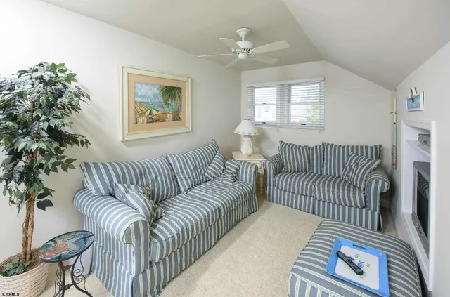 a view of a bedroom with furniture and windows