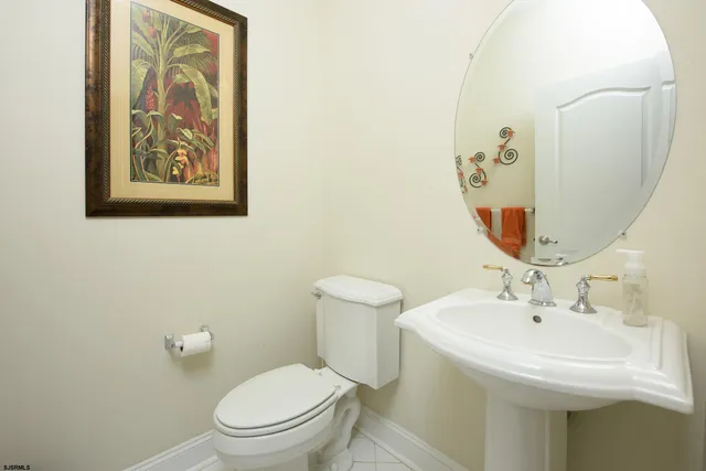a bathroom with a toilet and a sink
