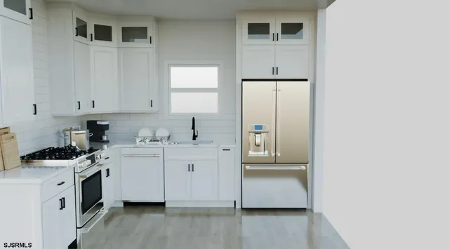 a kitchen with white cabinets and white appliances