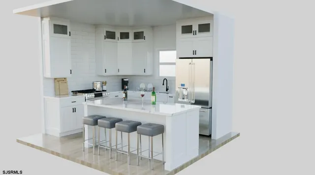 a kitchen with stainless steel appliances cabinets a sink and a refrigerator