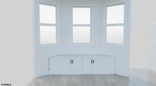 an empty room with windows