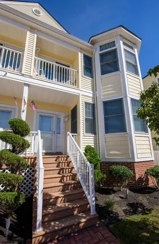 a front view of a house with stairs