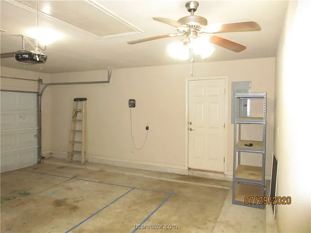 a view of a livingroom with a chandelier fan