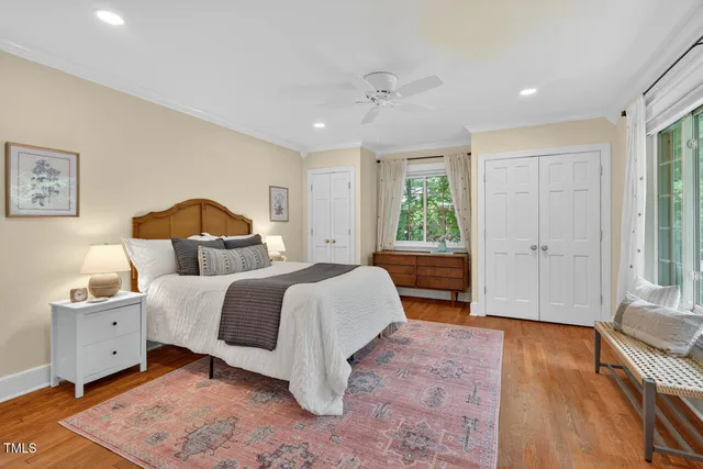 a bedroom with a large bed and a window