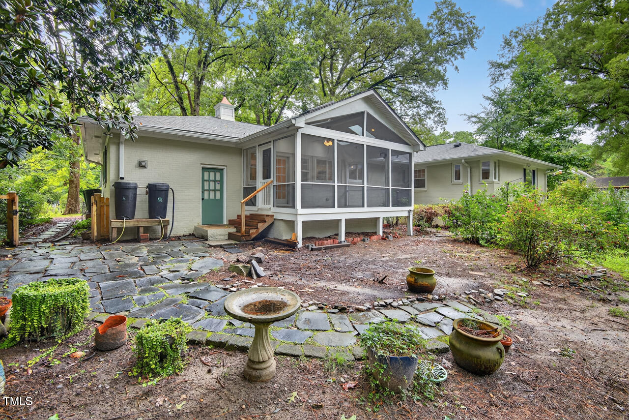 3535 Hope Valley Road Durham, NC 27707 - Photo 21 of 24 a view of a backyard with table and chairs potted plants