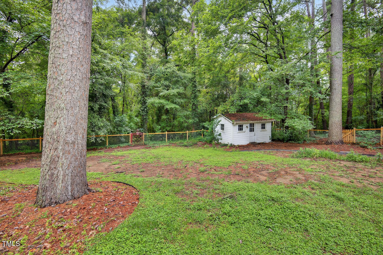 3535 Hope Valley Road Durham, NC 27707 - Photo 23 of 24 a backyard of a house with lots of green space
