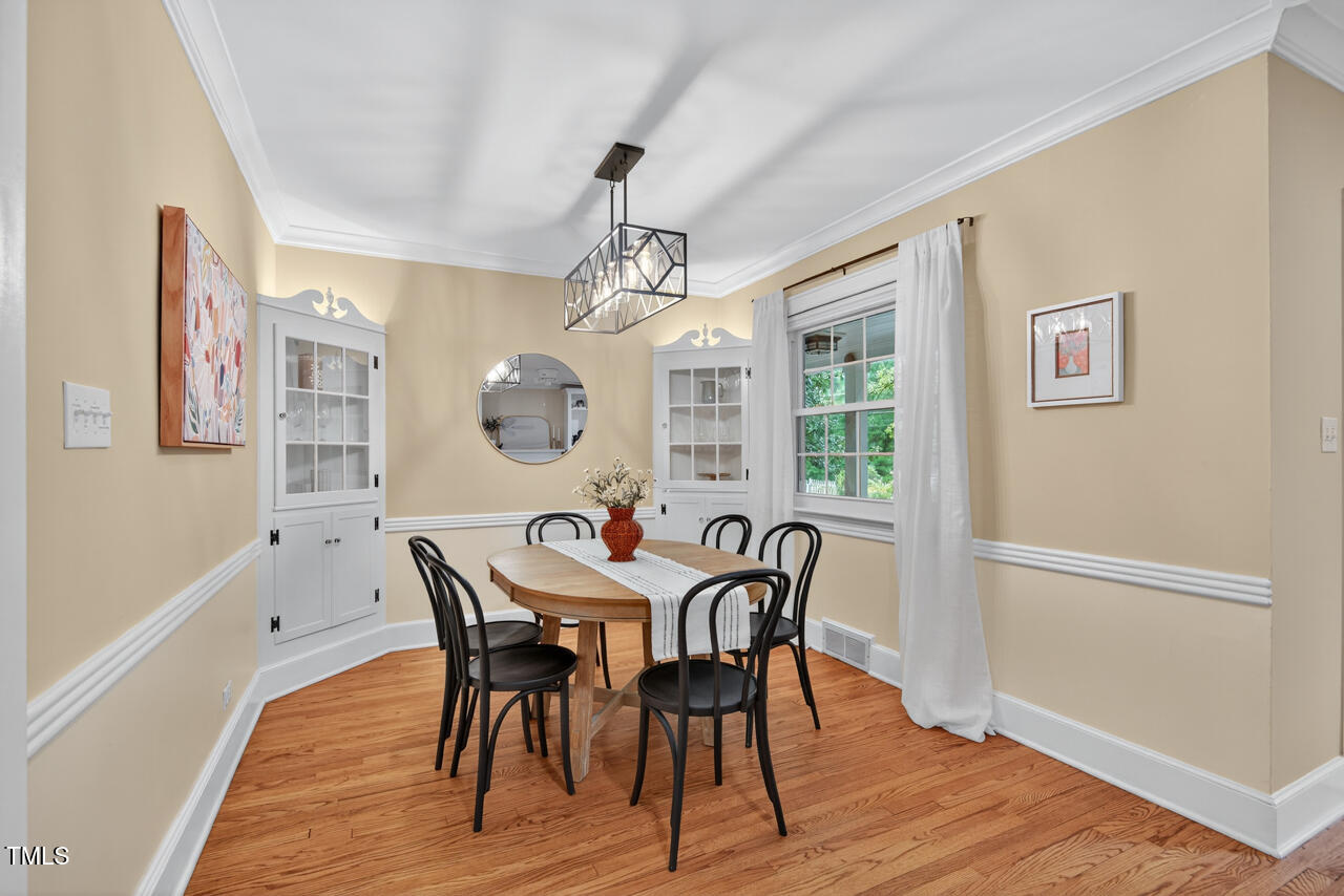 3535 Hope Valley Road Durham, NC 27707 - Photo 5 of 24 a view of a dining room with furniture window and wooden floor