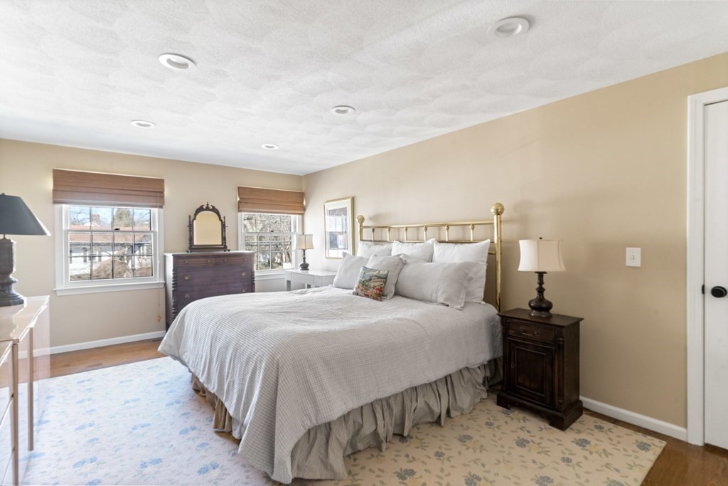 88 Standish Road Needham, MA 02492 - Photo 14 of 26 a bedroom with a bed and wooden floor