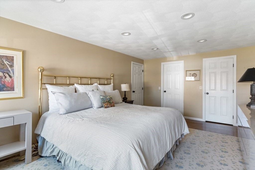 88 Standish Road Needham, MA 02492 - Photo 15 of 26 a bedroom with a bed and a couch