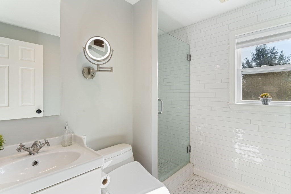 88 Standish Road Needham, MA 02492 - Photo 16 of 26 a bathroom with a sink a toilet and shower