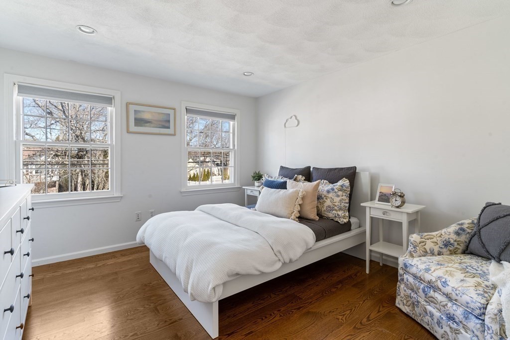 88 Standish Road Needham, MA 02492 - Photo 18 of 26 a bedroom with a bed and wooden floor
