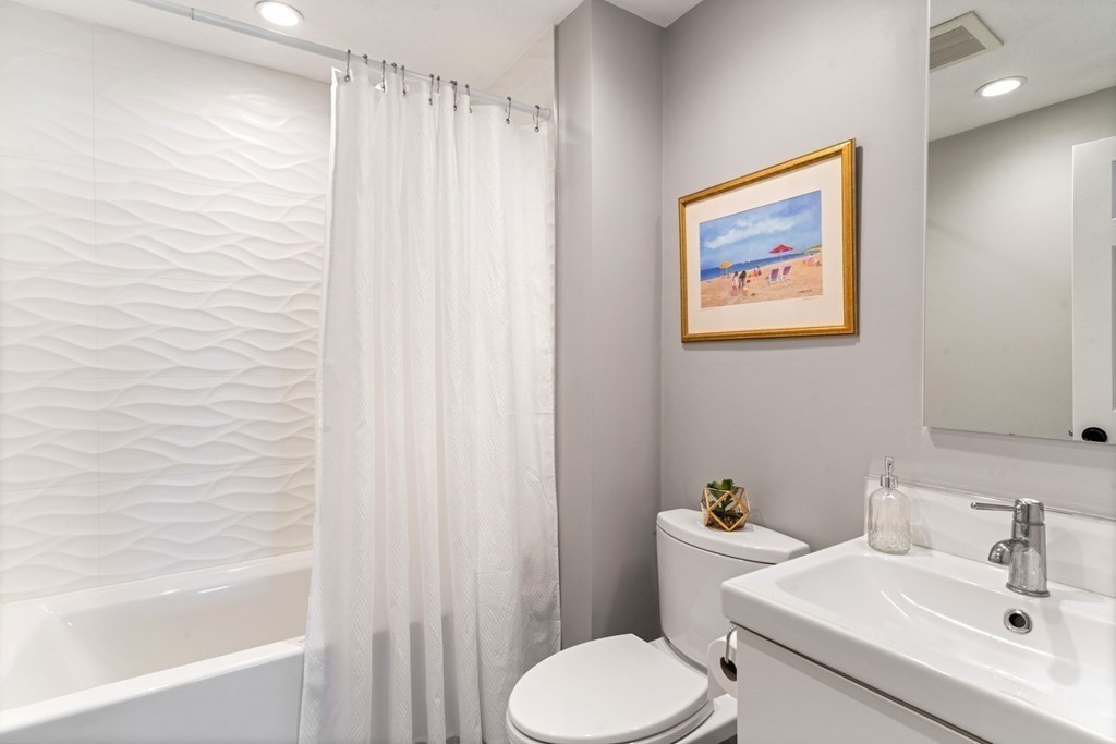88 Standish Road Needham, MA 02492 - Photo 19 of 26 a bathroom with a sink and toilet