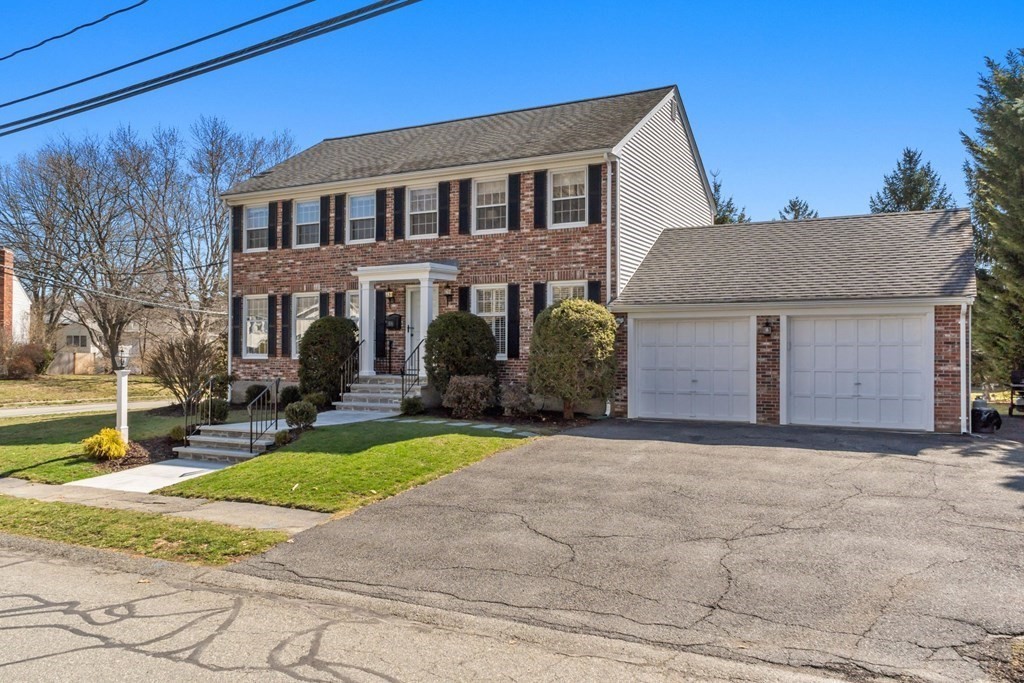 88 Standish Road Needham, MA 02492 - Photo 2 of 26 a front view of a house with garden