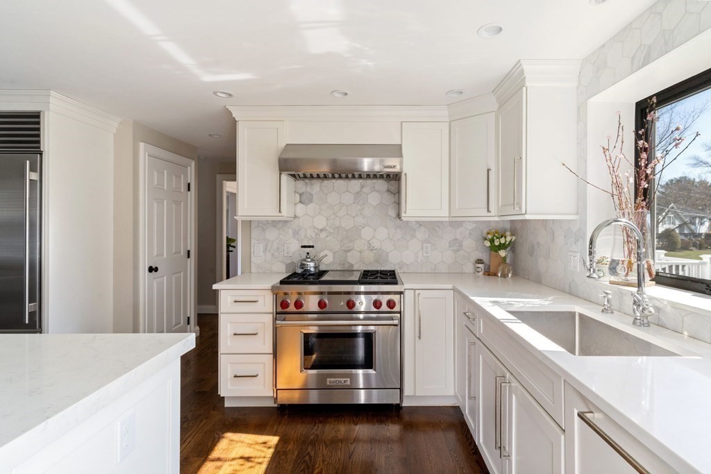 88 Standish Road Needham, MA 02492 - Photo 9 of 26 a kitchen with a stove sink and cabinets