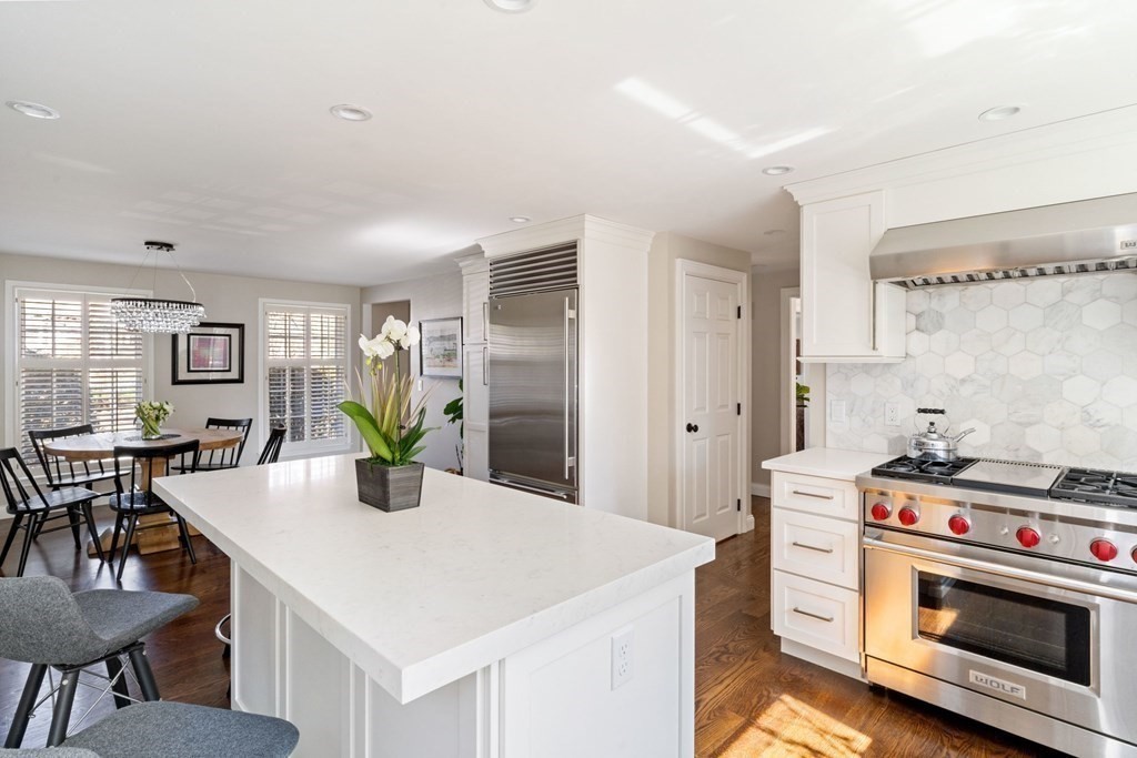 88 Standish Road Needham, MA 02492 - Photo 10 of 26 a kitchen with a stove a table and chairs