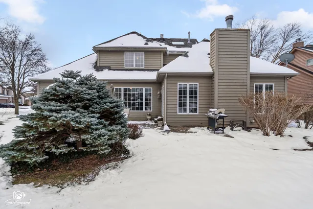 a view of snow covered with snow in yard