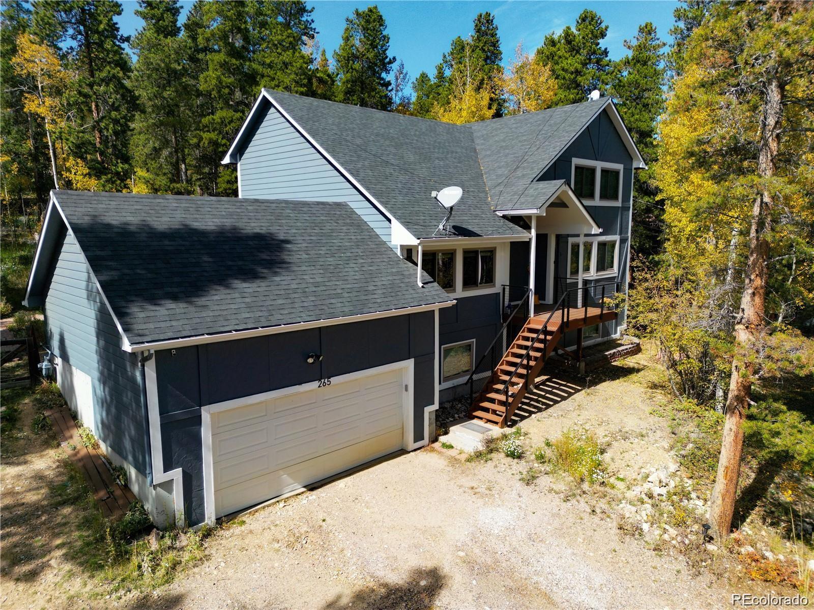 265 Caesar Road Black Hawk, CO 80422 - Photo 2 of 42 a aerial view of a house with a yard