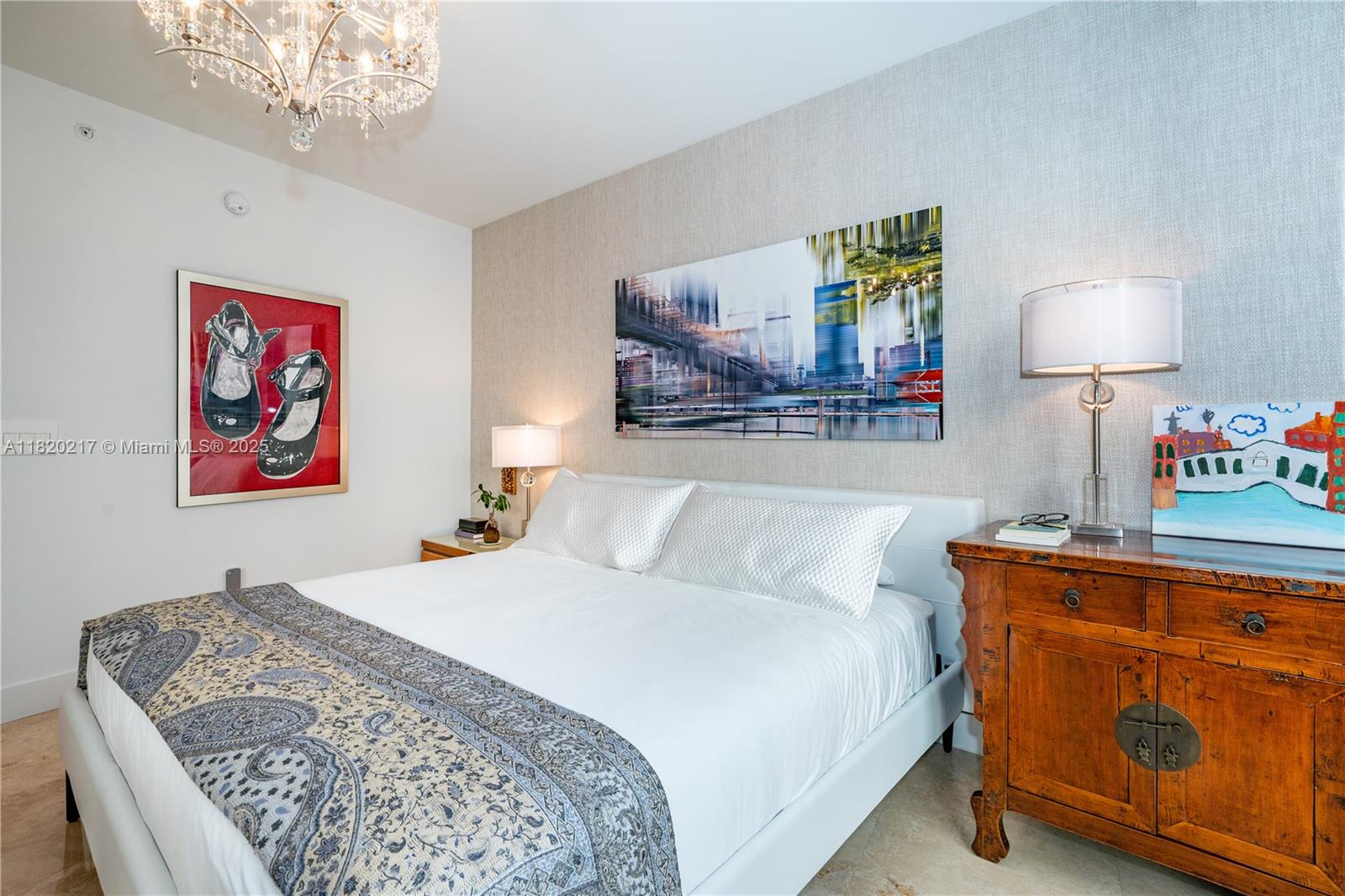 901 Brickell Key Boulevard, Unit 2602 Miami, FL 33131 - Photo 23 of 29 a bedroom with bed and a lamp on table