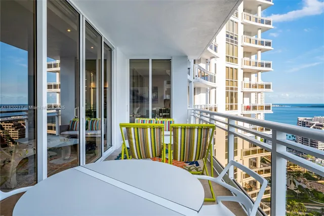 a view of a balcony with swimming pool