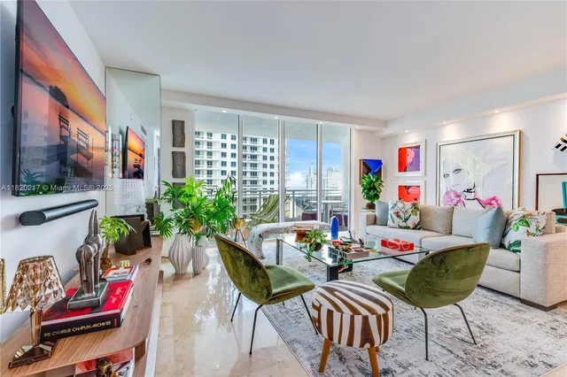 a view of a dining room with furniture and a potted plant