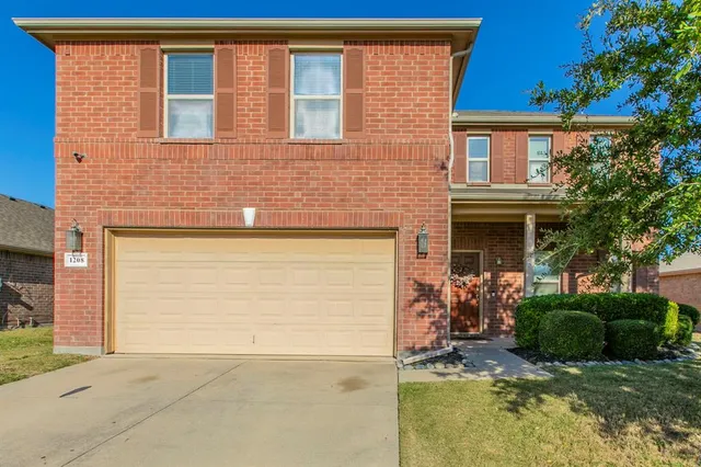 a view of house with backyard space and a car parked in front of it