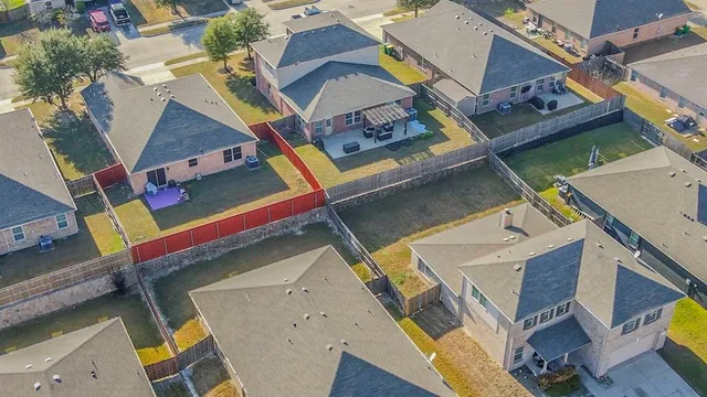 an aerial view of a house with a ocean view