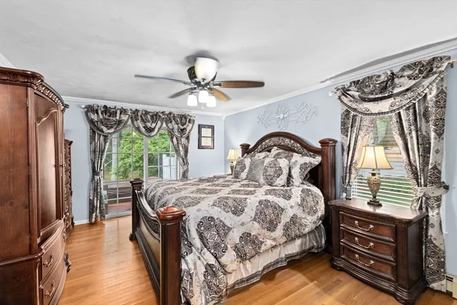 a bedroom with a bed next to a window