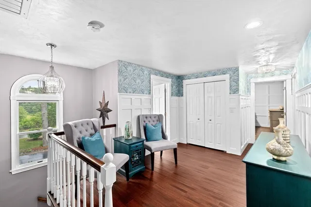 a view of a room with furniture window and wooden floor