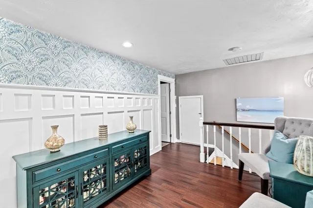 a view of wooden floor and dining room