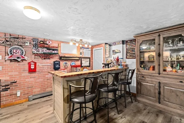 a kitchen that has a table and chairs in it