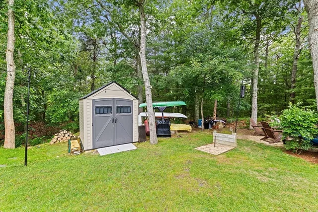 a view of a house with backyard porch and sitting area