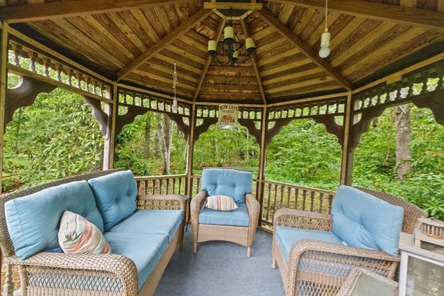 a balcony with furniture and a garden