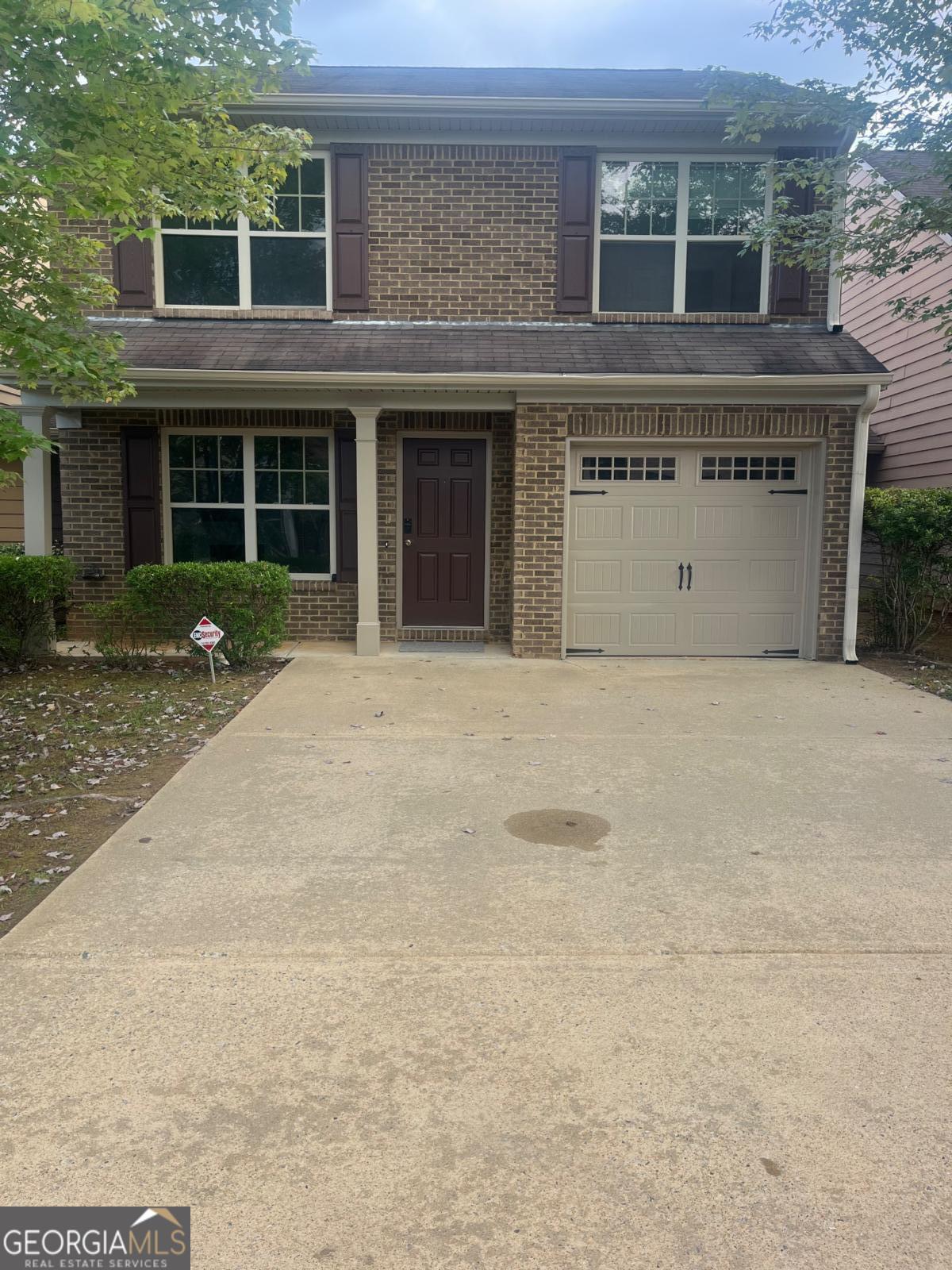 312 Lauren Drive Fairburn, GA 30213 - Photo 1 of 1 front view of a building with a yard