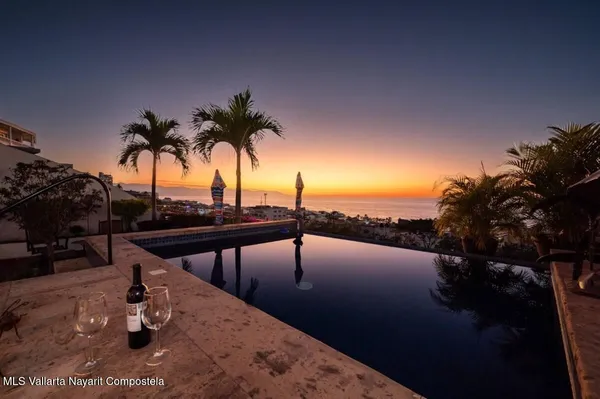 a view of swimming pool with outdoor seating
