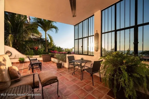 an outdoor space with patio furniture