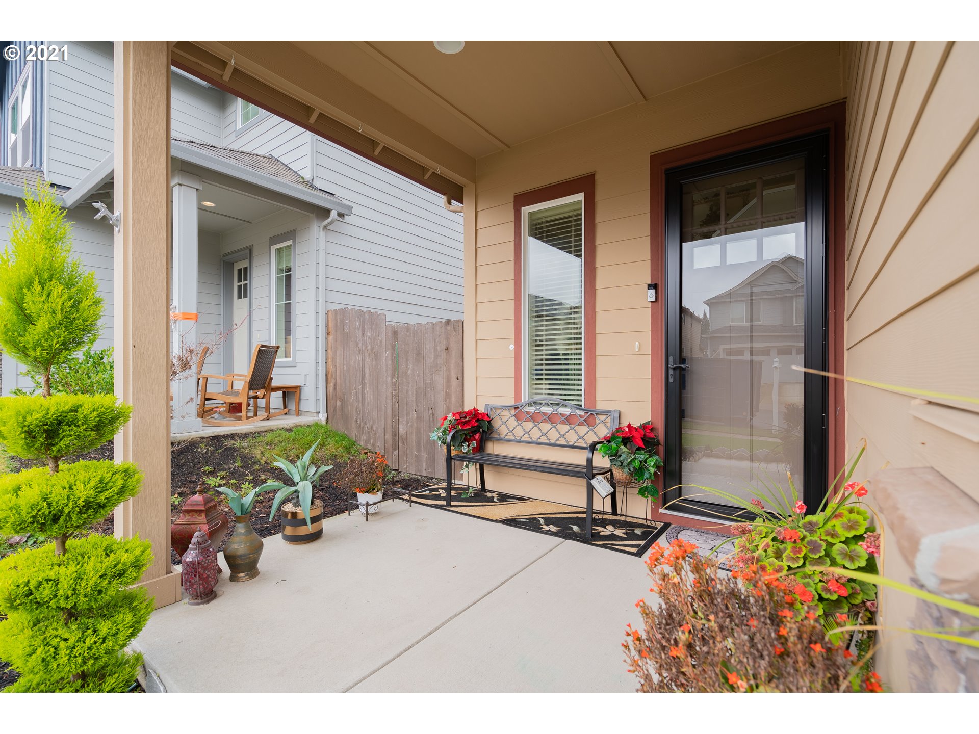 1248 South Quail Run Place Ridgefield, WA 98642 - Photo 2 of 28 a view of a house with chairs and potted plants