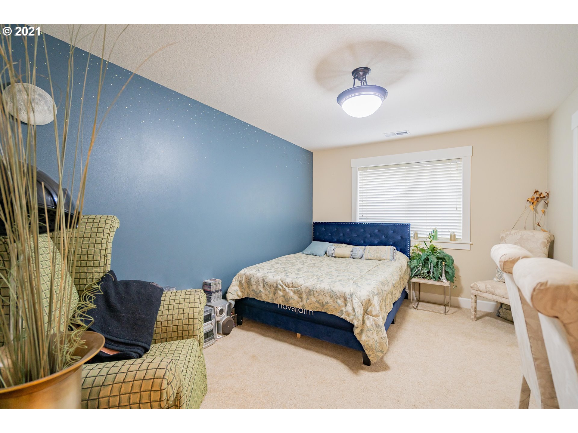 1248 South Quail Run Place Ridgefield, WA 98642 - Photo 15 of 28 a bedroom with a bed window and a table