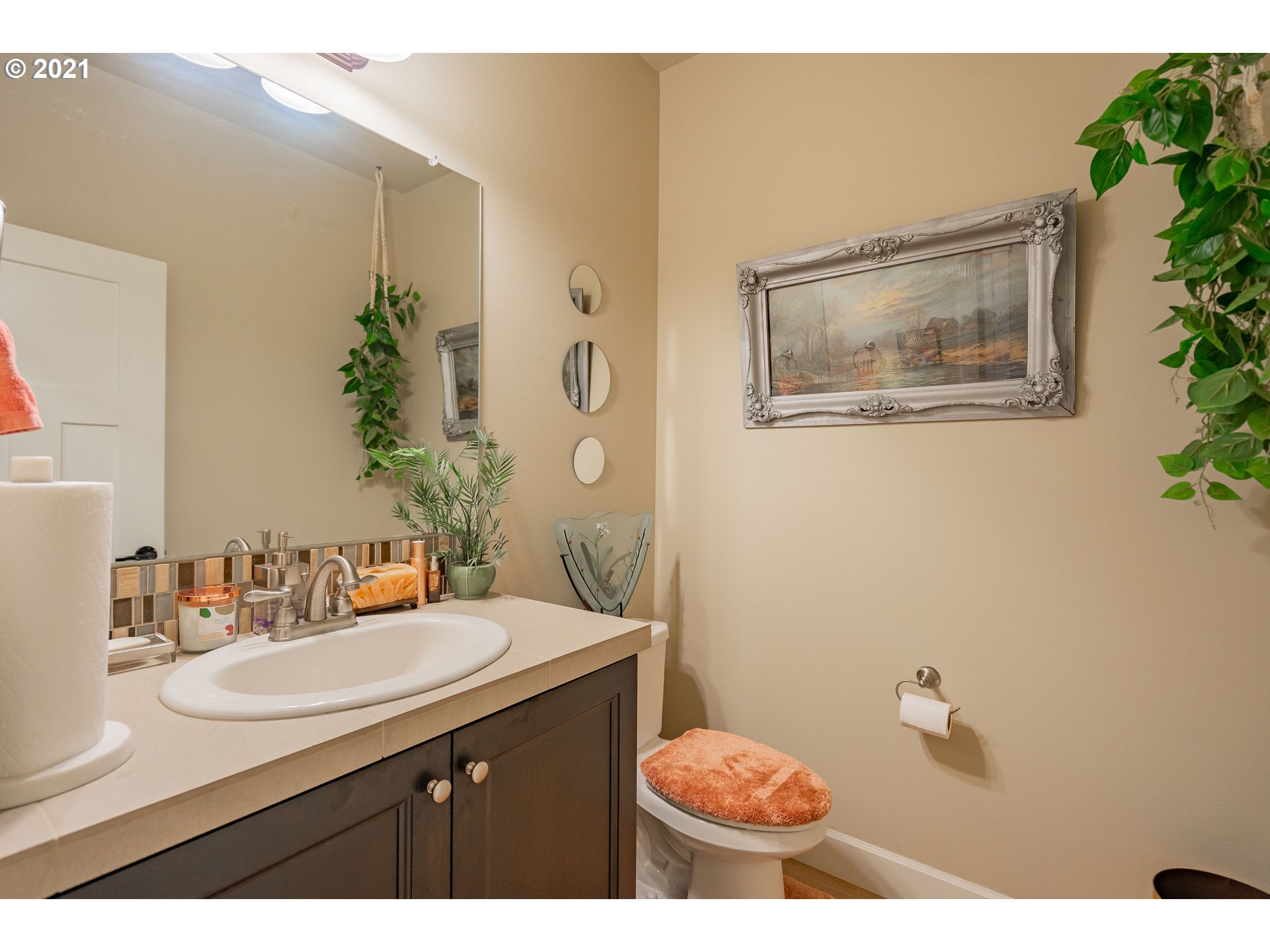 1248 South Quail Run Place Ridgefield, WA 98642 - Photo 24 of 28 a bathroom with a sink mirror and vanity