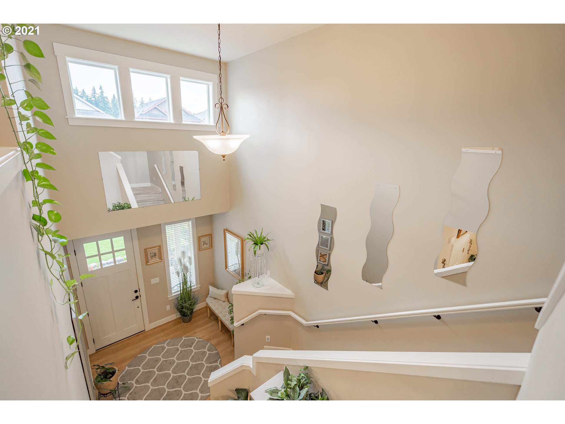 1248 South Quail Run Place Ridgefield, WA 98642 - Photo 4 of 28 a bathroom with a window and mirror