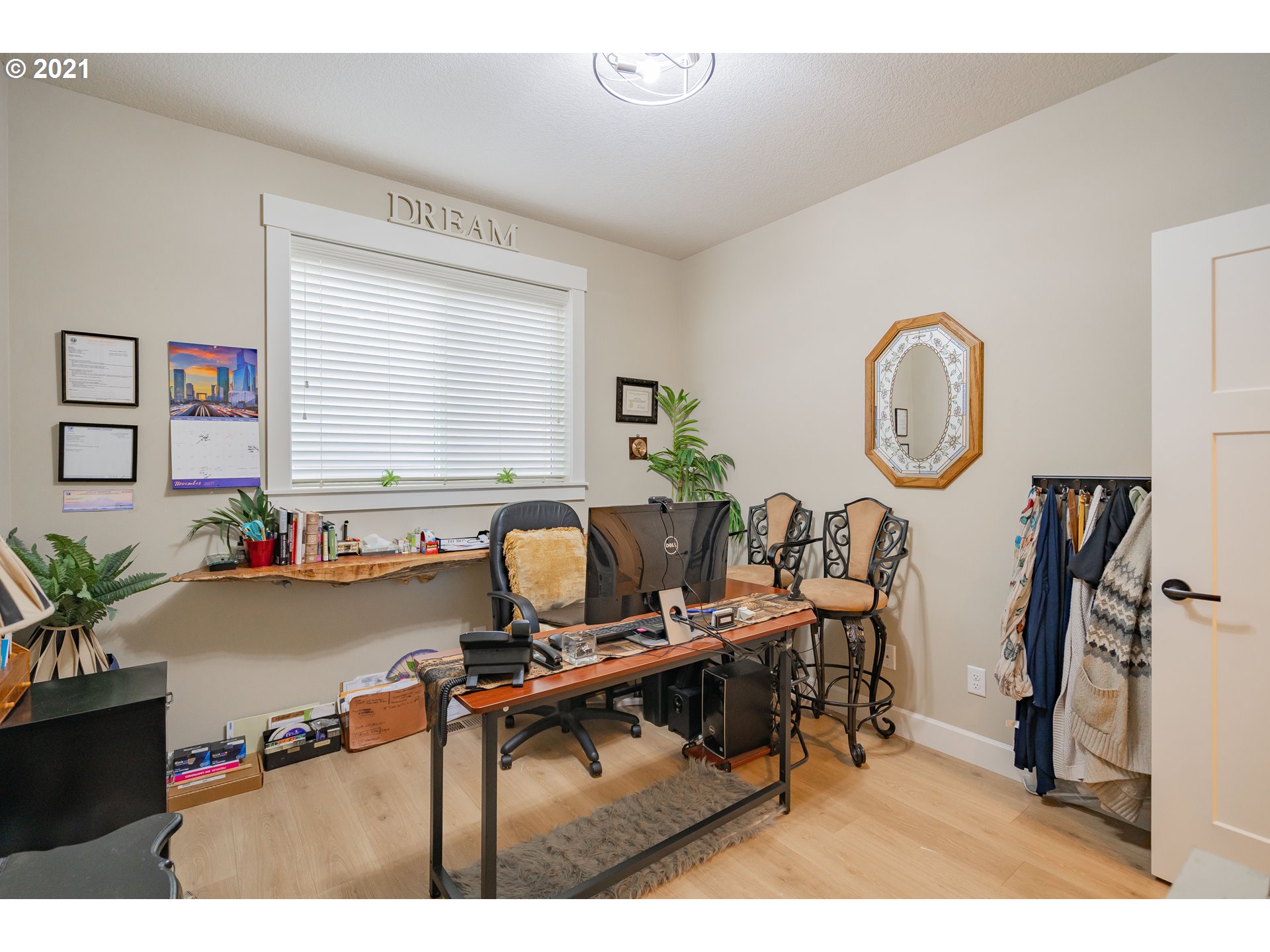 1248 South Quail Run Place Ridgefield, WA 98642 - Photo 5 of 28 a living room with furniture a large window and a potted plant