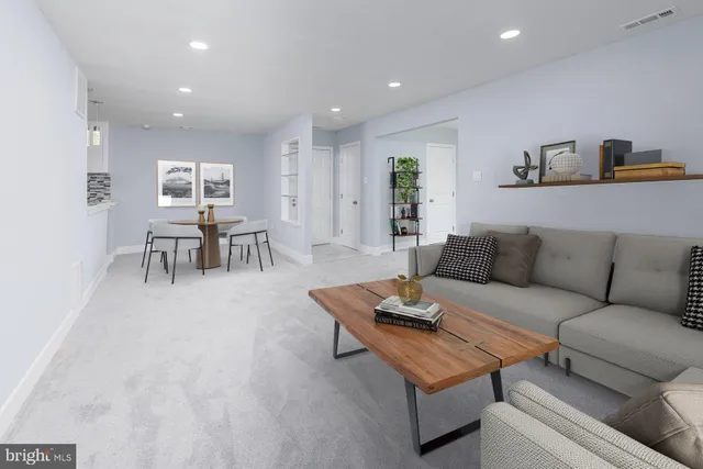 a living room with furniture and a table