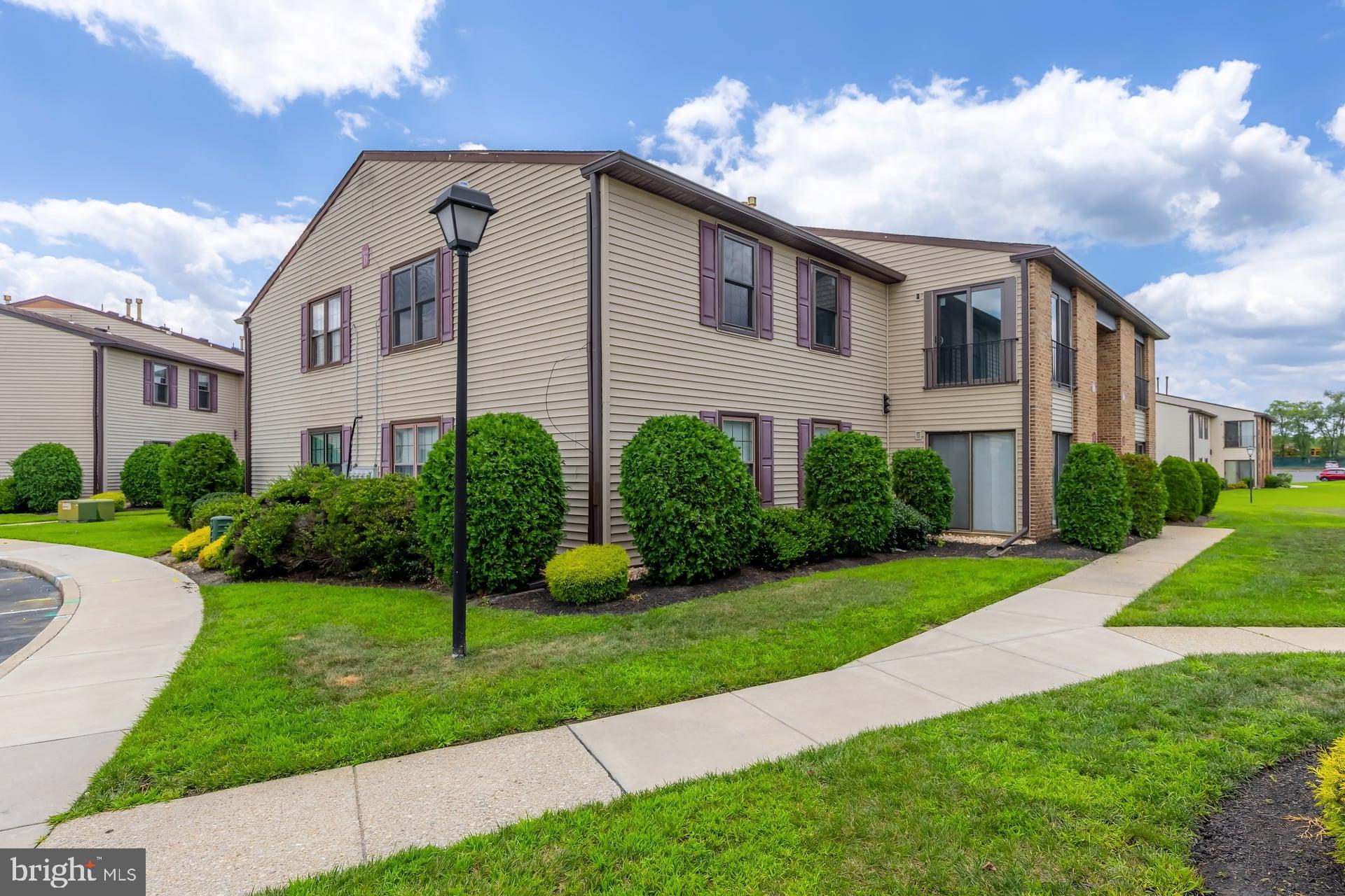 18 Brighton Place Sewell, NJ 08080 - Photo 4 of 19 a front view of a house with garden and plants