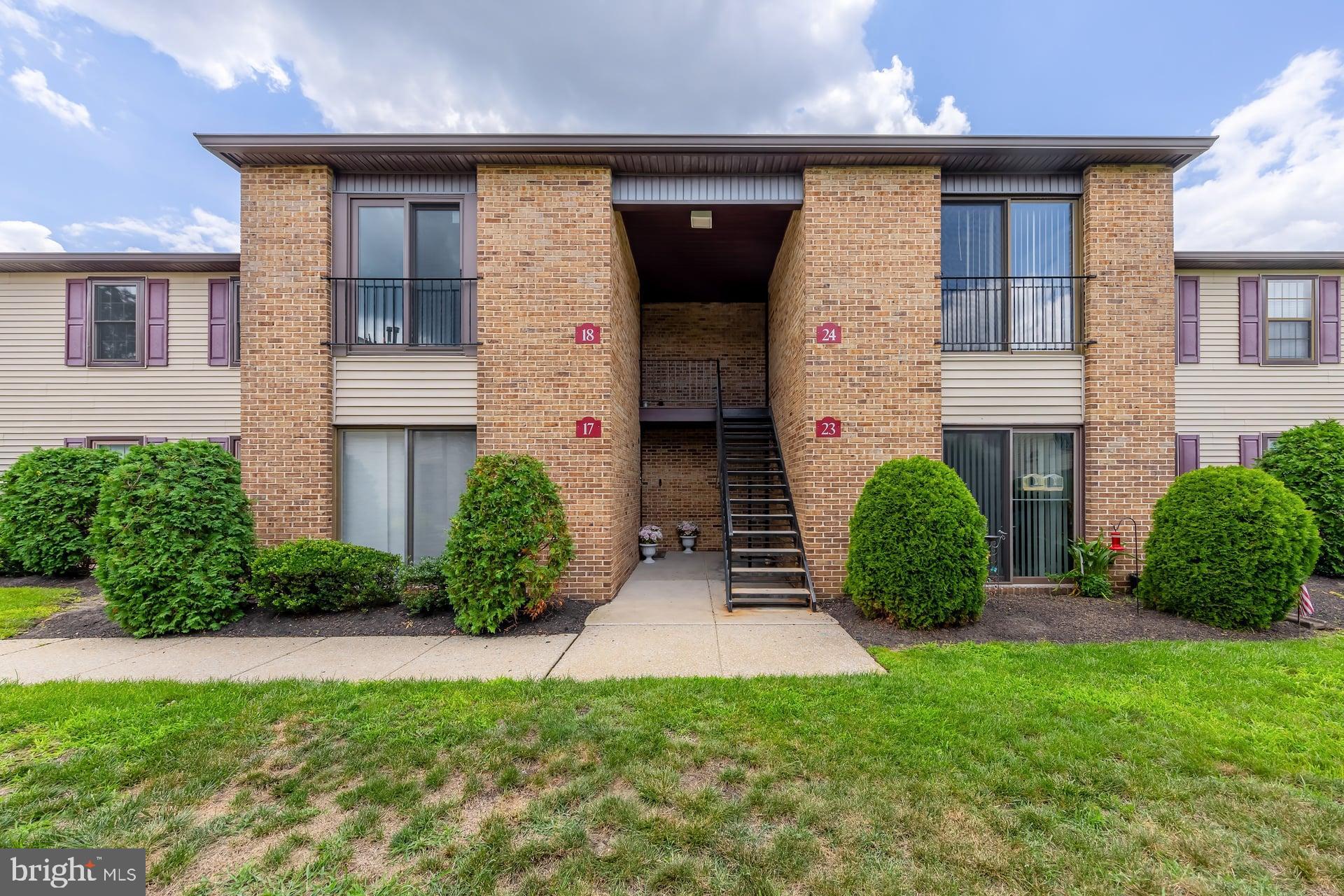 18 Brighton Place Sewell, NJ 08080 - Photo 6 of 19 a front view of a house with a yard and garage