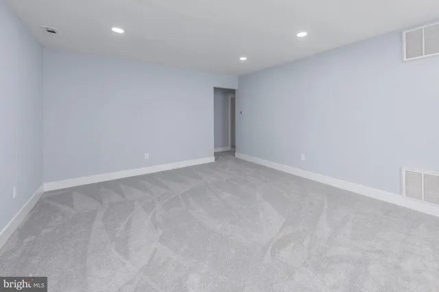 a view of an empty room with a balcony