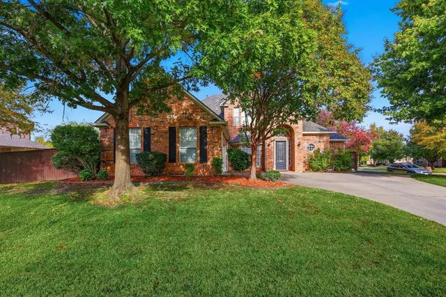 a view of a house with a yard porch and sitting area