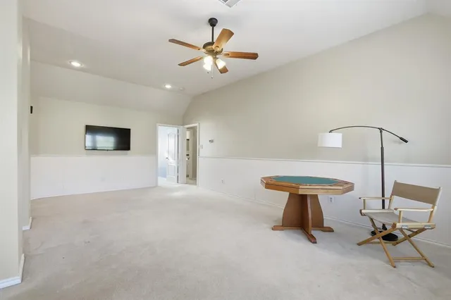 a lamp room with furniture and a ceiling fan