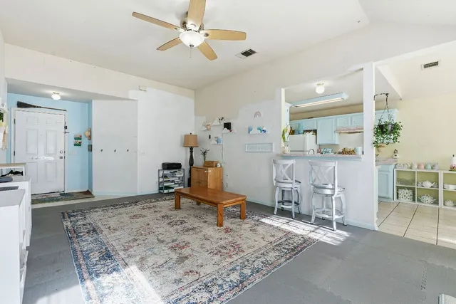 a view of a dining room with furniture and a window
